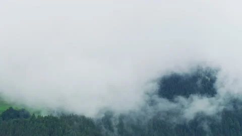 Mountain shrouded in clouds Video stock 219716523