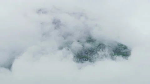 Mountain shrouded in clouds Stock Footage 219742749