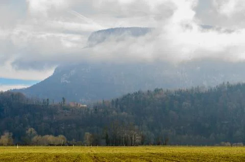 Mountain shrouded in clouds Stock Photos