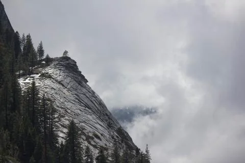 Mountain side with clouds rolling in Stock Photos