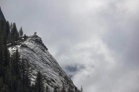 Mountain side with clouds rolling in Stock Photos