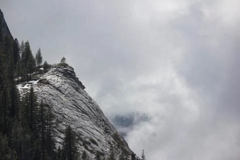Mountain side with clouds rolling in Stock Photos