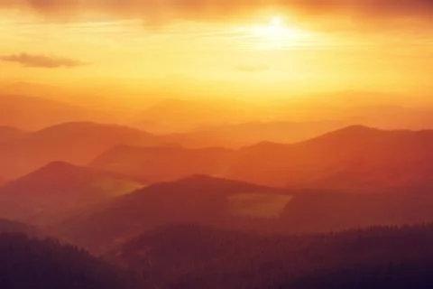 Mountain silhouettes at sunset Stock Photos