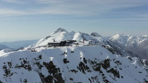 Mountain ski resort with snowy Aibga ridge and ski elevator. Snowy resort on Video stock 146741253