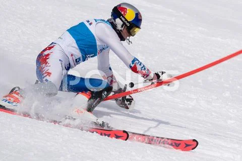 Mountain skier skiing down mount slope. Russian Alpine Skiing Cup, slalom Stock Photos