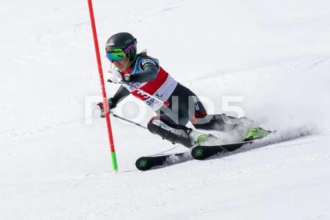 Mountain skier skiing down mount slope. International Ski Federation Champion Stock Photos