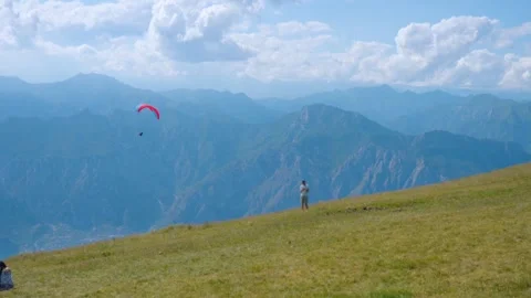 Mountain sky cloud parachute paragliding Video stock 274414910