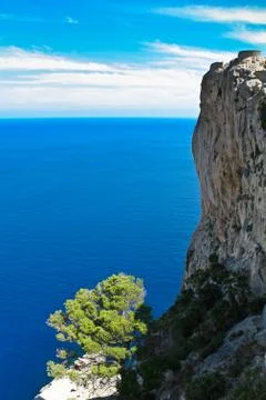 Mountain slope into the sea Stock Photos