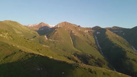 Mountain slopes covered with green grass Video stock 247857663