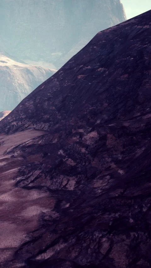 Mountain slopes with rocky textures in a distant landscape under blue sky Stock Footage 341270385