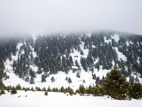Mountain with snow and clouds Stock Photos