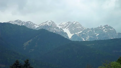 Mountain with snow and clouds in summer Stock Footage 54046959