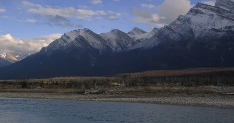 Mountain snows above the Saskatchewan River foreshadowing Winter’s arrival Stock Footage 86190759