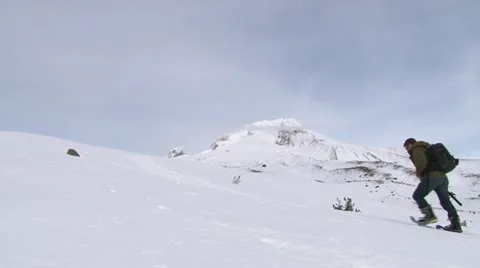 Mountain Snowshoeing Up Stock Footage