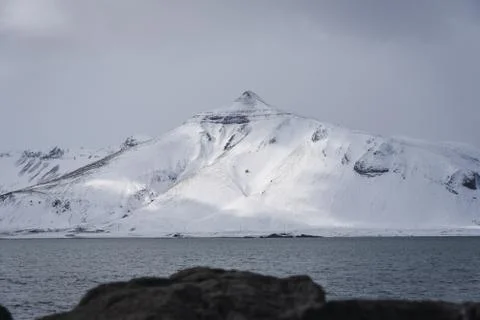 Mountain with soft light shining through the clouds 库存照片