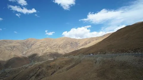 Mountain with some cloud on the blue clear sky Stock Photos