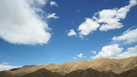 Mountain with some cloud on the blue clear sky Stock Photos
