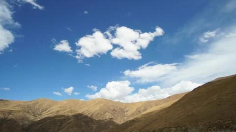 Mountain with some cloud on the blue clear sky Stock Photos