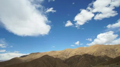 Mountain with some cloud on the blue clear sky Stock Photos