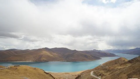 Mountain with some cloud on the blue clear sky and the river Stock Photos