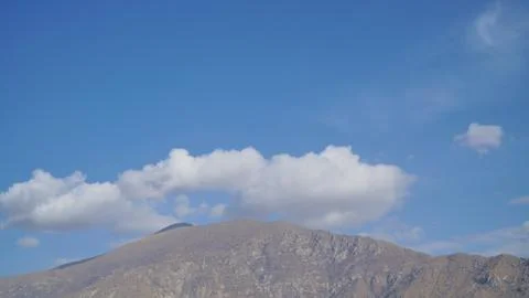 Mountain with some cloud on the blue clear sky Stock Photos