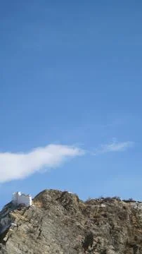 Mountain with some cloud on the blue clear sky Stock Photos