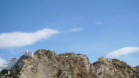 Mountain with some cloud on the blue clear sky Stock Photos
