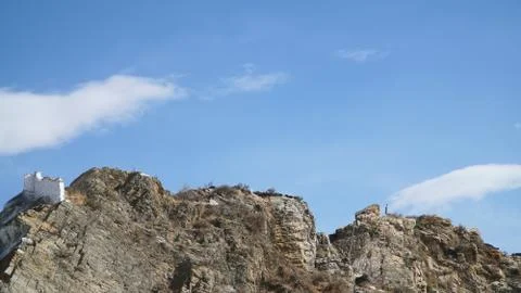 Mountain with some cloud on the blue clear sky Stock Photos