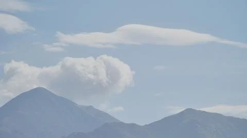 Mountain with some cloud on the blue clear sky Stock Photos