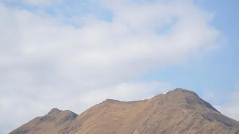Mountain with some cloud on the blue clear sky Stock Photos