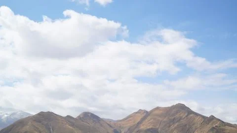 Mountain with some cloud on the blue clear sky Stock Photos