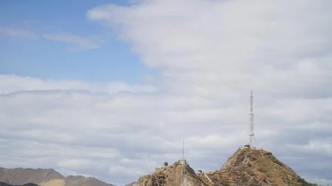 Mountain with some cloud on the blue clear sky Stock Photos