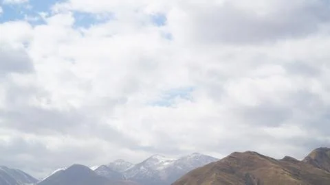 Mountain with some cloud on the blue clear sky Stock Photos