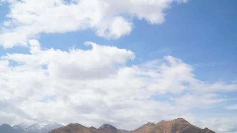 Mountain with some cloud on the blue clear sky Stock Photos