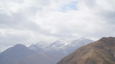 Mountain with some cloud on the blue clear sky Stock Photos