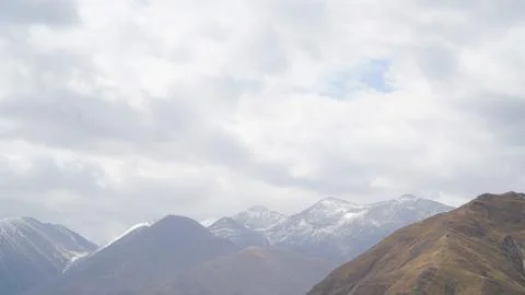 Mountain with some cloud on the blue clear sky Stock Photos