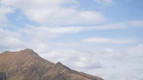 Mountain with some cloud on the blue clear sky Stock Photos