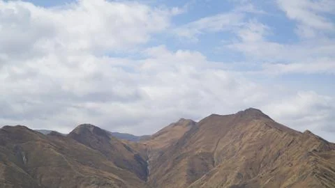 Mountain with some cloud on the blue clear sky Stock Photos