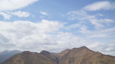 Mountain with some cloud on the blue clear sky Stock Photos