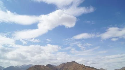 Mountain with some cloud on the blue clear sky Stock Photos
