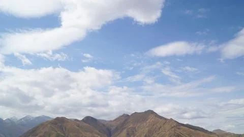 Mountain with some cloud on the blue clear sky Stock Photos