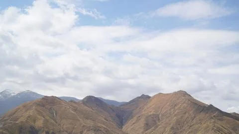 Mountain with some cloud on the blue clear sky Stock Photos