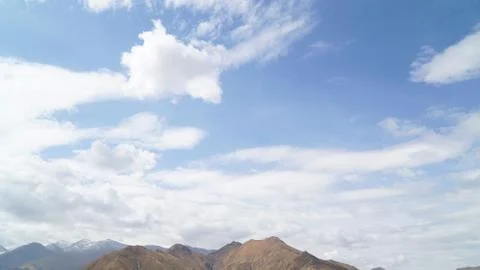 Mountain with some cloud on the blue clear sky Stock Photos