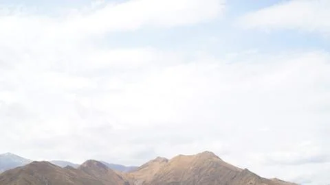 Mountain with some cloud on the blue clear sky Stock Photos