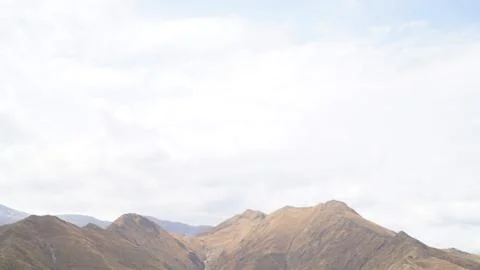 Mountain with some cloud on the blue clear sky Stock Photos