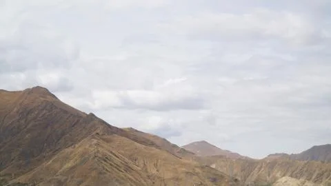 Mountain with some cloud on the blue clear sky Stock Photos