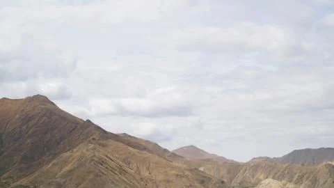 Mountain with some cloud on the blue clear sky Stock Photos
