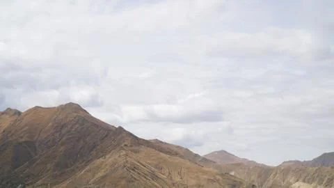 Mountain with some cloud on the blue clear sky Stock Photos