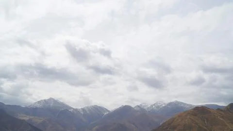 Mountain with some cloud on the blue clear sky Stock Photos