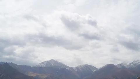 Mountain with some cloud on the blue clear sky Stock Photos